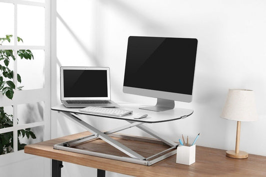 laptop placed on a desk converter
